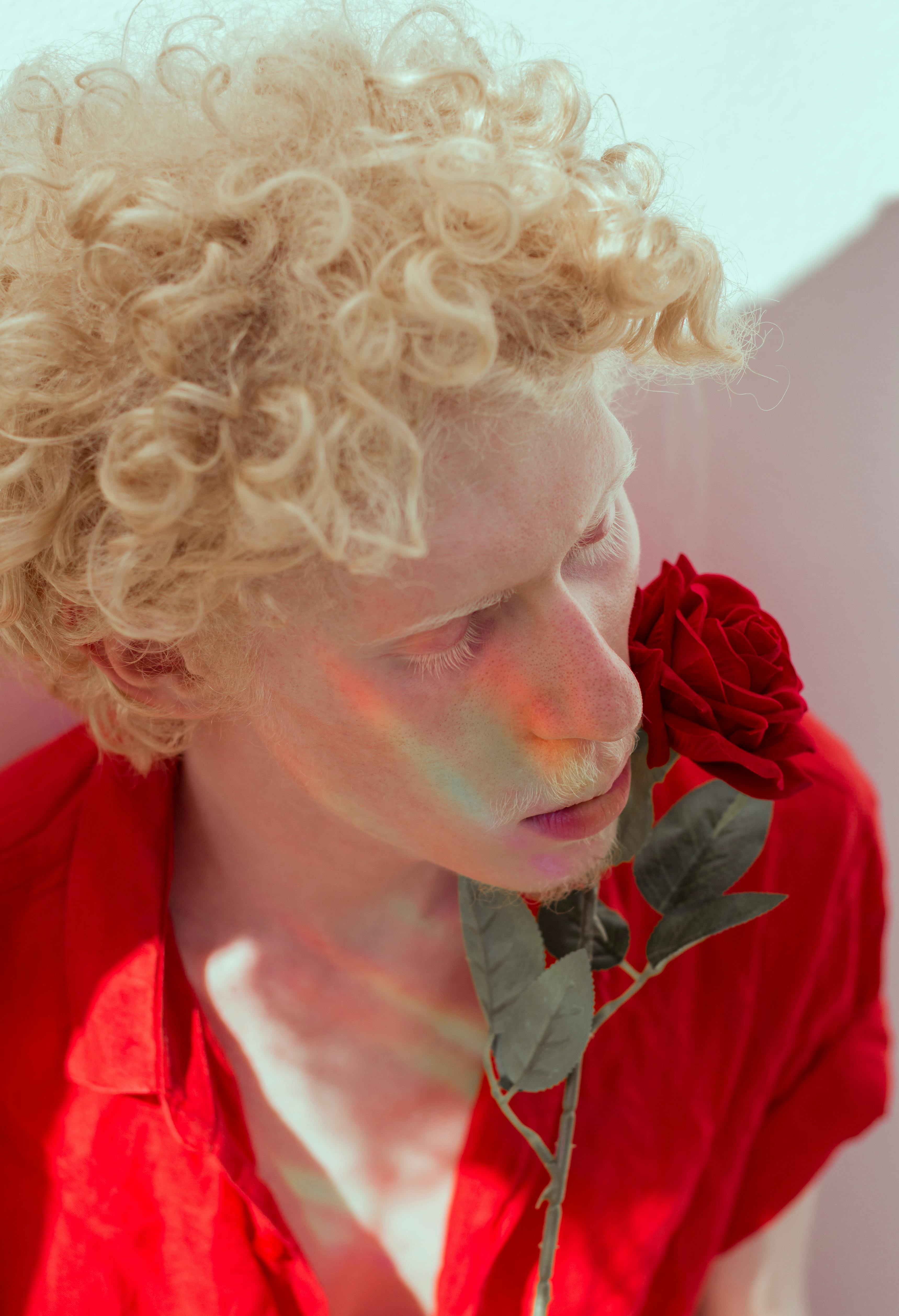 man holding red rose