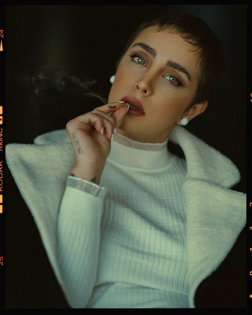 Model in Sweater Wearing Makeup