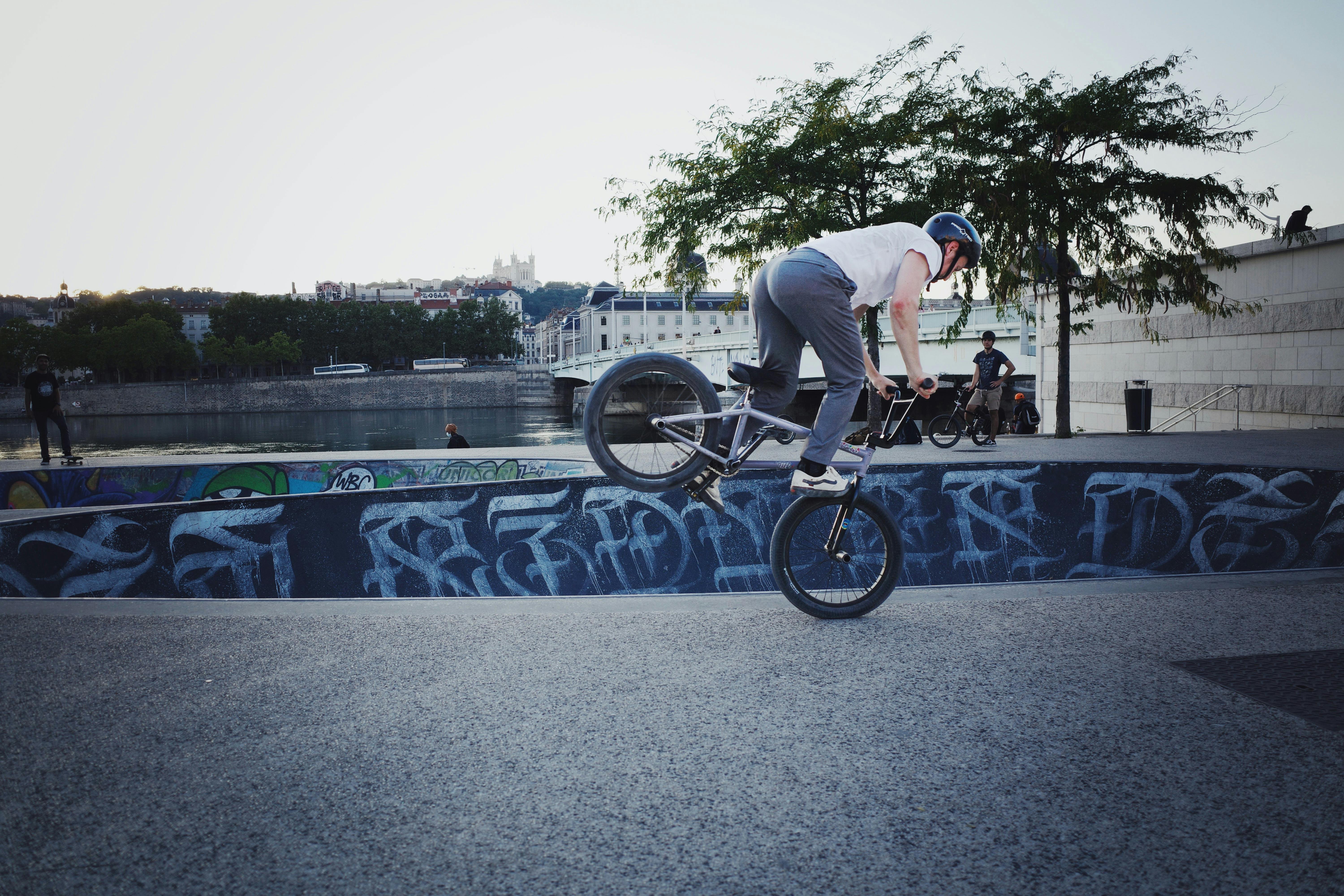 Guy Doing Tricks On Bike In Recreation Park · Free Stock Photo