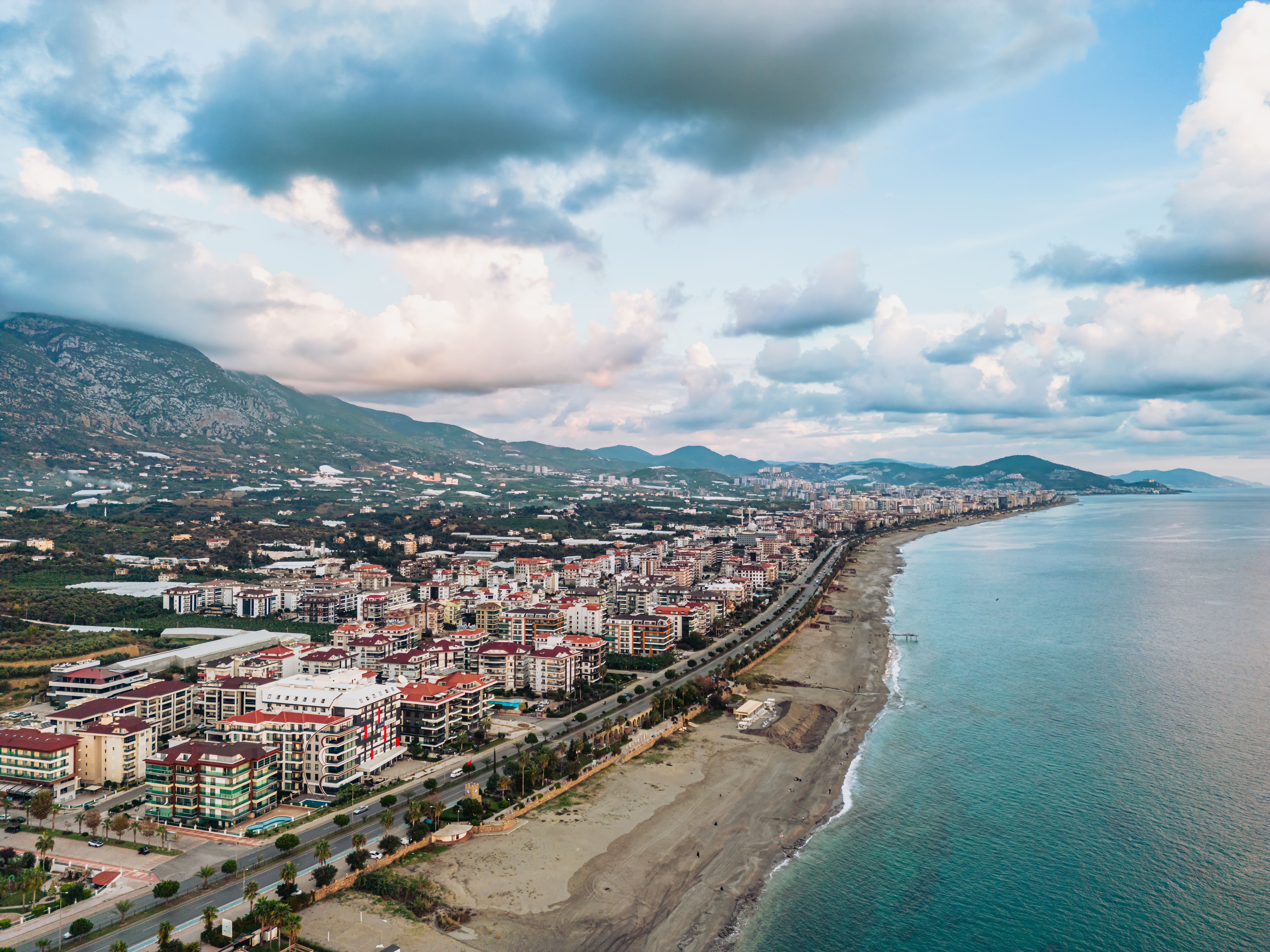 Aerial view of a city, mountains and sea · Free Stock Photo