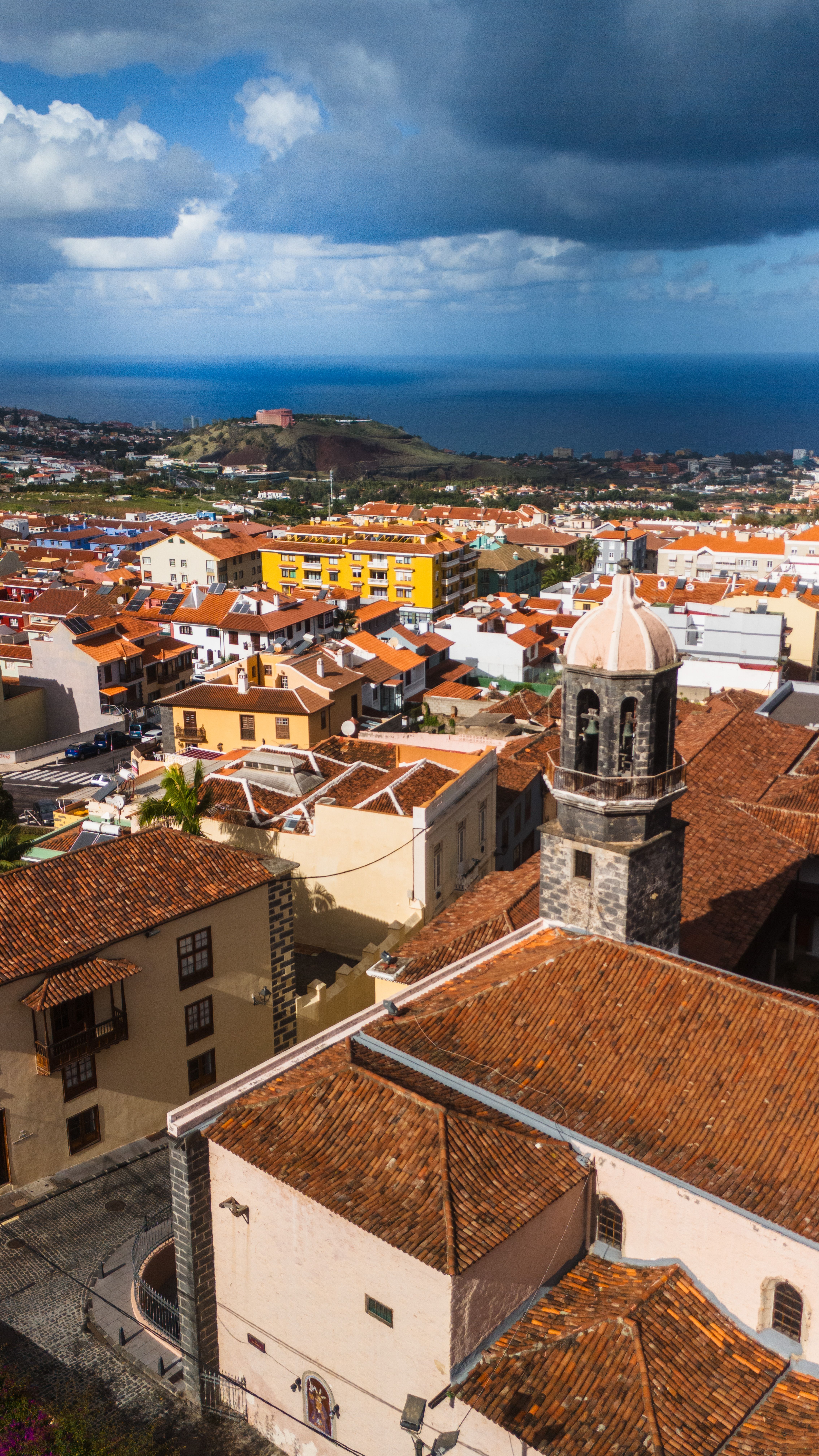Explore the stunning rooftops and sea views of La Orotava in Tenerife, Spain. A charming urban landscape.