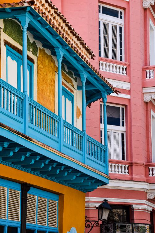 Free Vibrant colonial architecture in the streets of Havana, showcasing colorful facades and classic balconies. Stock Photo