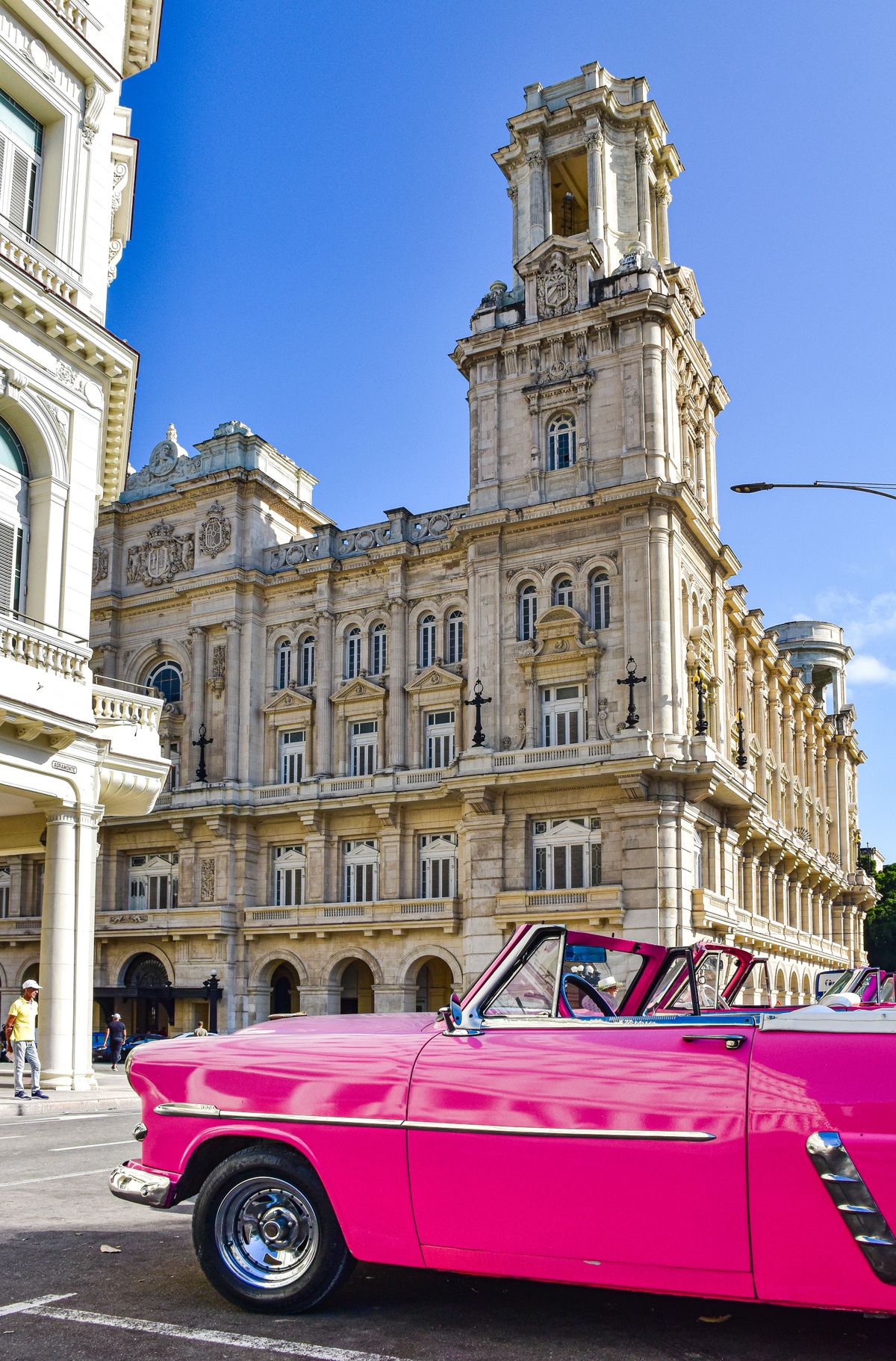 Can I Travel to Cuba? What Canadians Actually Need in 2026-2027 4 Pink vintage American car parked outside a museum building in Havana, Cuba
