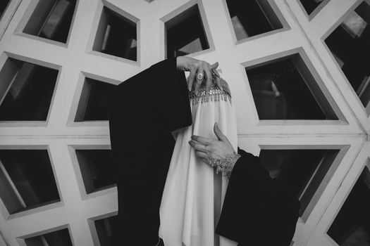 Woman covered in veil escorted out of Florida county meeting after playing call to prayer recording