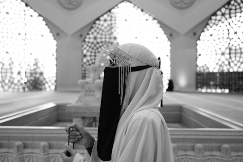 Woman Praying with Rosary in Hands