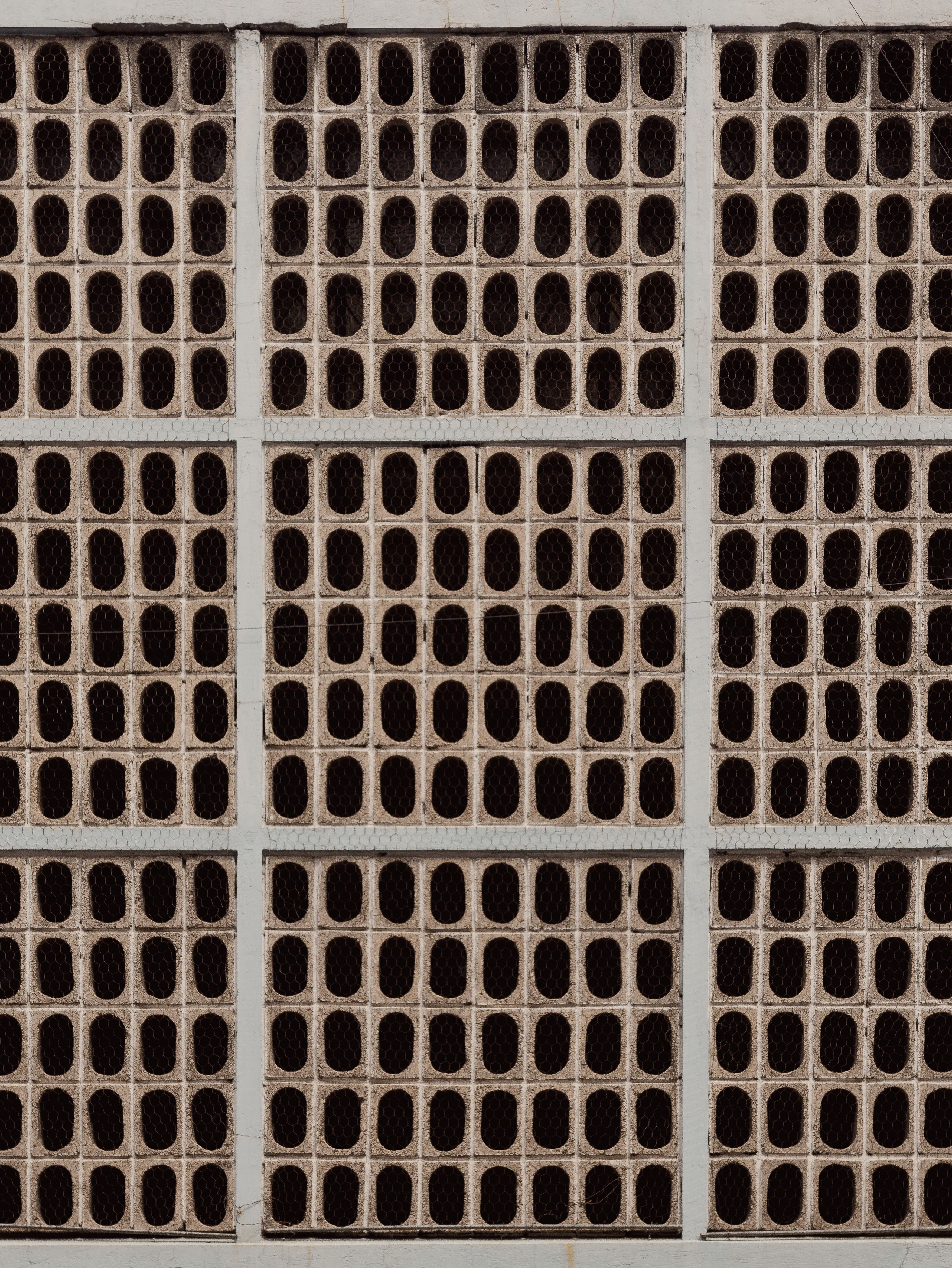 Close-up of a textured wall pattern in Puebla, Mexico, showcasing architectural design.