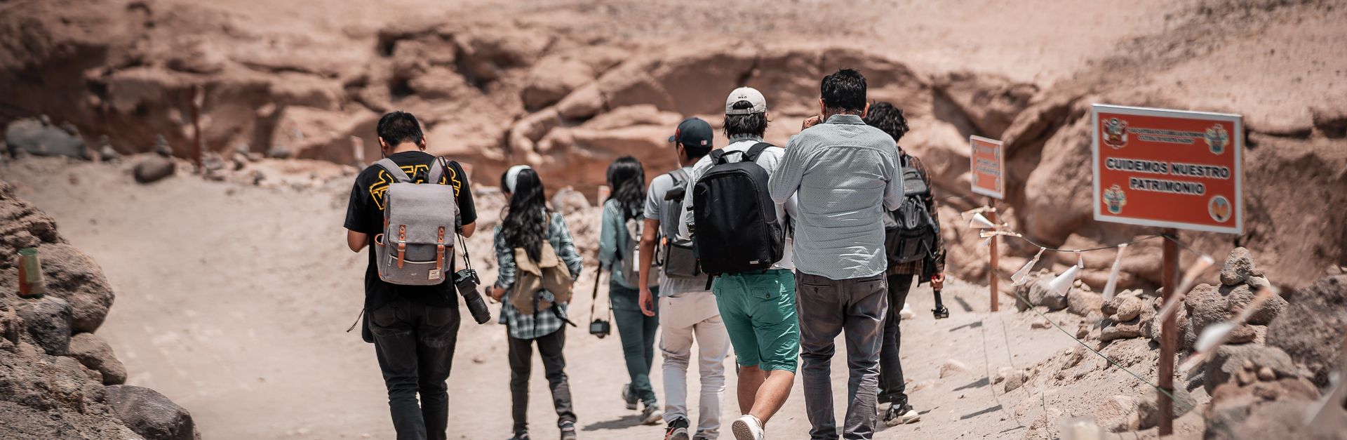 A group of hikers explores the arid terrain of Arequipa, Peru, creating a sense of adventure.