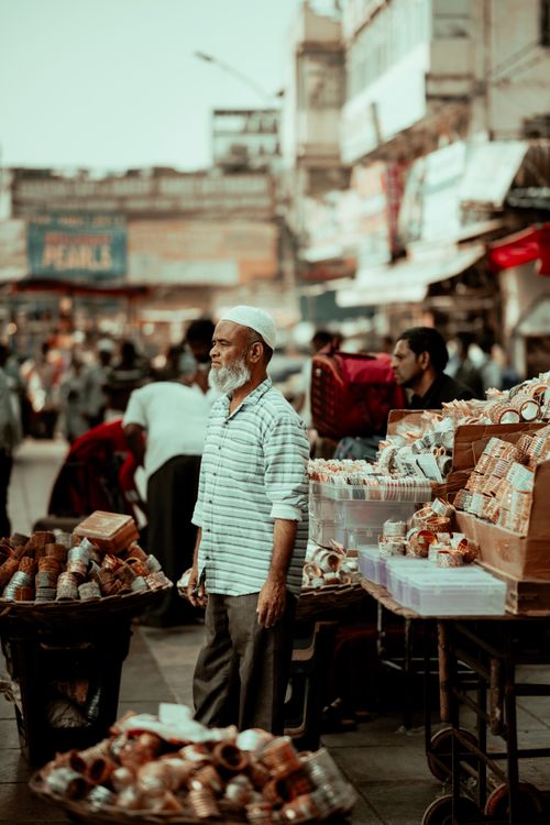 Free A bustling street market in Hyderabad with vendors and shoppers, showcasing traditional everyday life. Stock Photo