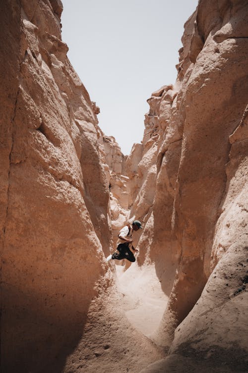 Man Jumping in Canyon