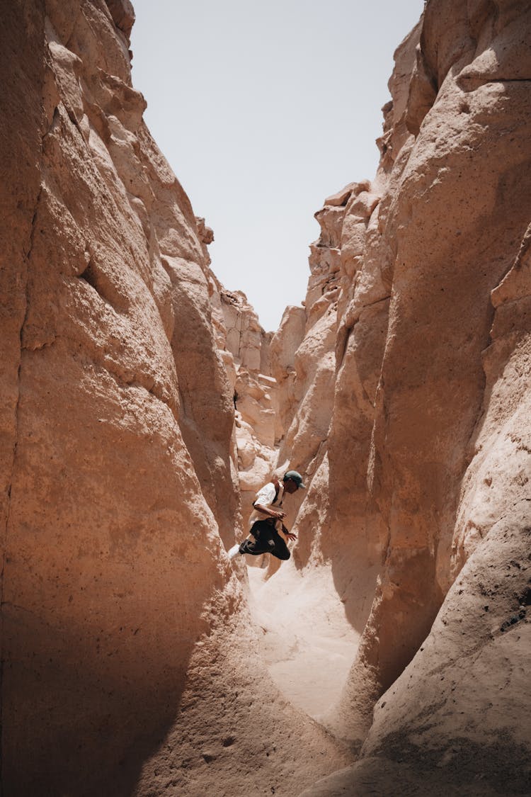 Man Jumping In Canyon