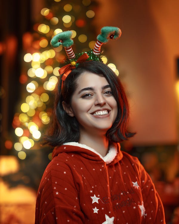 Smiling Woman with Christmas Hairband with Antlers