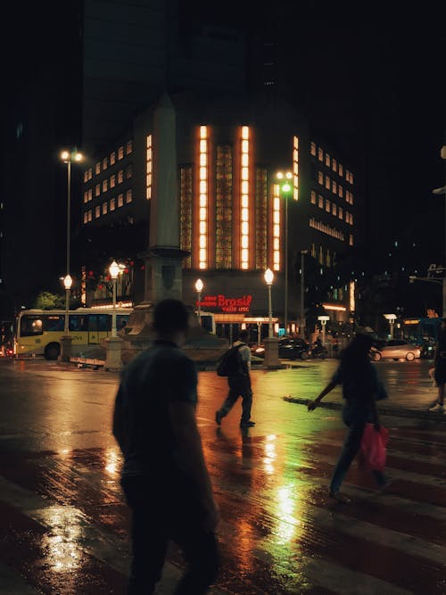 People Crossing Street at Night