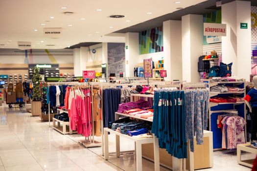 A clothing store with many different clothing items