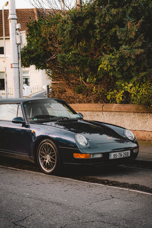 A Sports Car Parked on the Side of the Street 