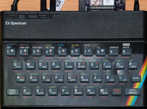 Close-up of a vintage Sinclair ZX Spectrum keyboard showcasing its colorful keys and retro design.