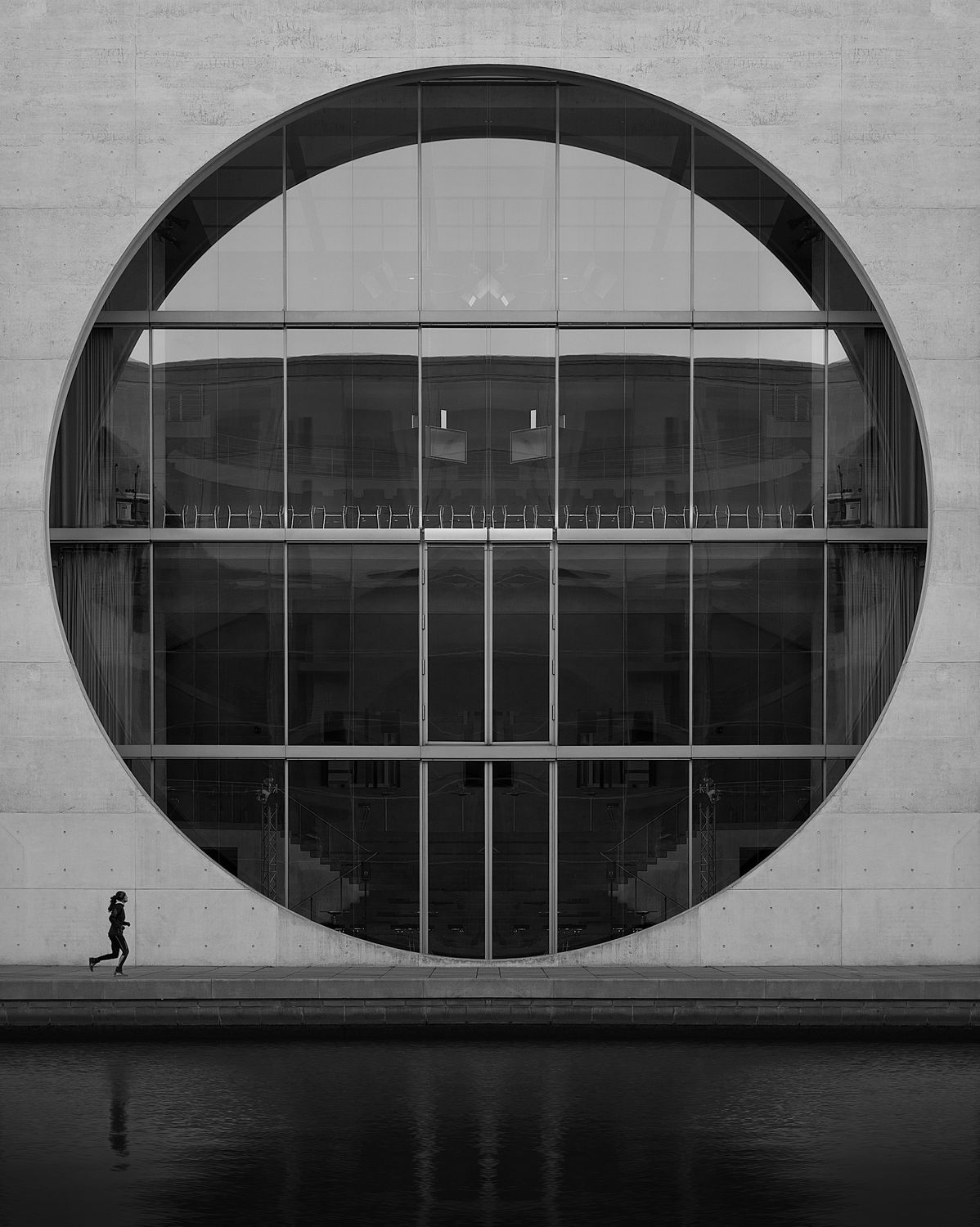 Woman Running near Building Window and Wall · Free Stock Photo