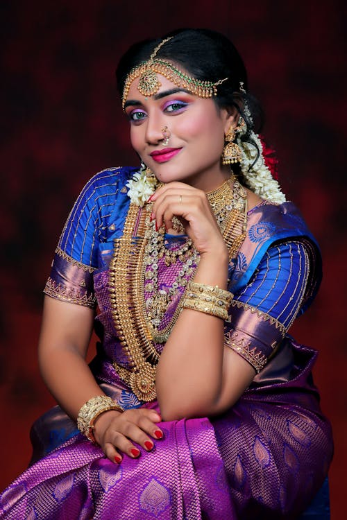 Woman Sitting in Traditional Clothing