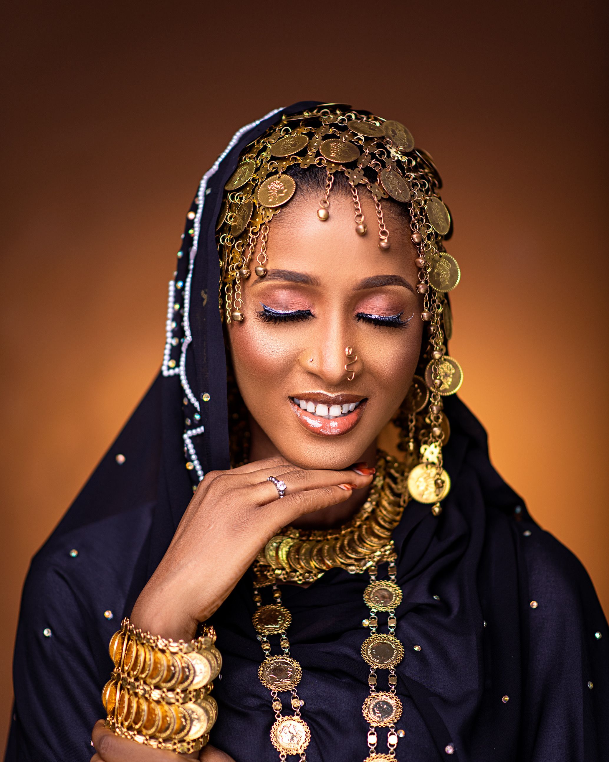 Smiling Model in Traditional Clothes and Jewelry · Free Stock Photo
