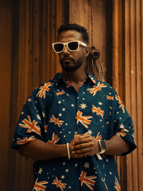 Free Fashion portrait of a stylish man in London wearing a British flag shirt and sunglasses. Stock Photo