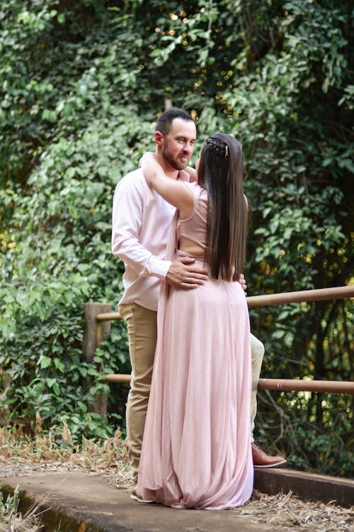 Couple Embracing on the Bridge