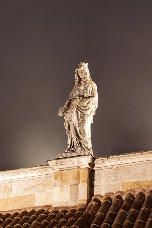 Statue of a Woman on a Wall