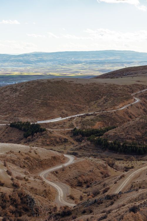 Free A winding road snakes through the hills of Merzifon, Amasya, offering a stunning natural landscape. Stock Photo
