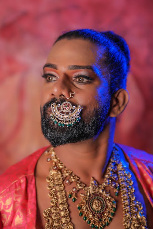 Man with Piercing and Golden Jewelry