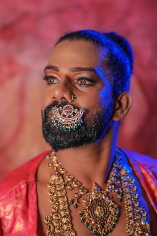 Free Striking portrait of a man in traditional attire with intricate jewelry and nose ring. Stock Photo