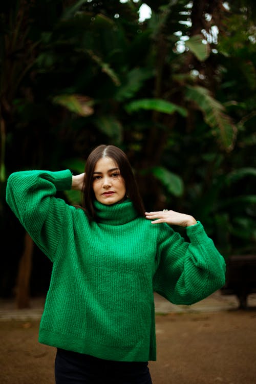 Pretty Brunette Woman in Green Sweater