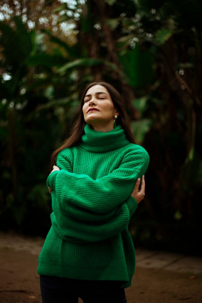 Forest green cropped sweater with high rise straight leg jeans