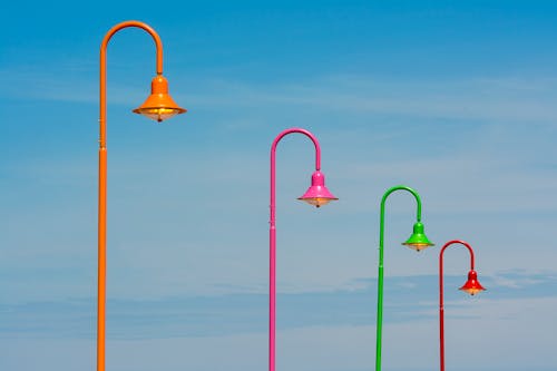 Colorful Streetlamps Against Sky