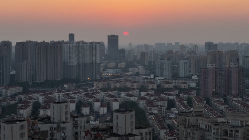 Free A breathtaking view of China's urban skyline at sunset, highlighting tall buildings and a vibrant skyline. Stock Photo