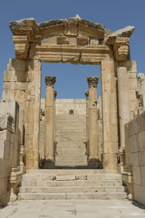 Free Explore ancient Roman ruins featuring majestic columns and stone architecture under a clear sky. Stock Photo