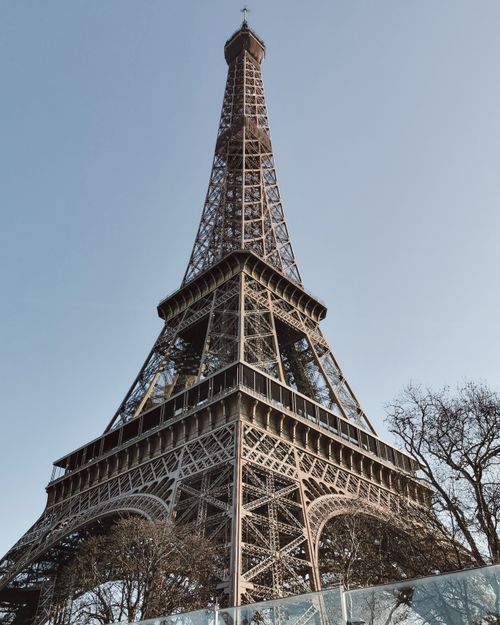 Free Stunning view of the Eiffel Tower reaching into the clear Parisian sky, iconic architectural landmark. Stock Photo