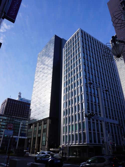 Free View of modern skyscrapers in a vibrant downtown area on a sunny day. Stock Photo
