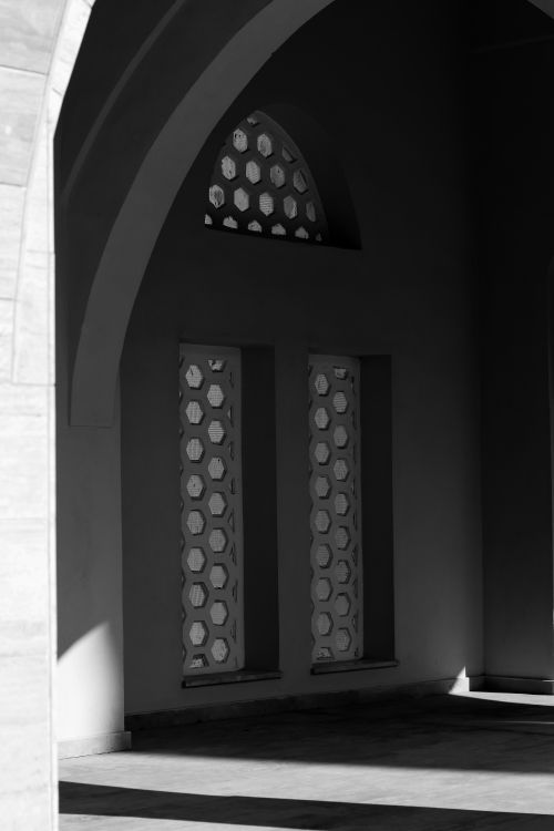 Free Intricate shadows cast by a hexagonal window in a Turkish building's archway, Bolu. Stock Photo