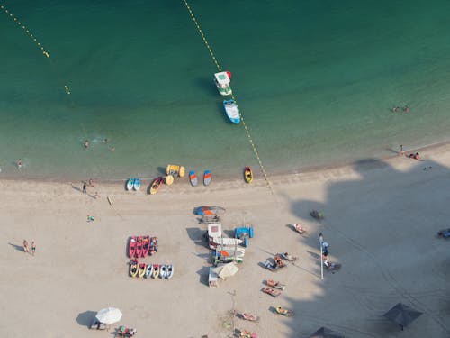 Boats and People on Beach in Birds Eye View