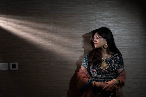 Young Woman Wearing a Traditional Dress and Henna Tattoos 