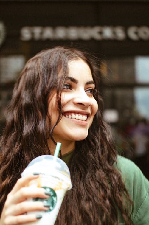 Portrait of Smiling Brunette Woman with Coffee
