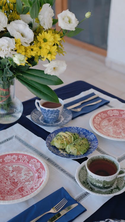 Free A Table Set for Breakfast with Cups of Tea and Avocado  Stock Photo