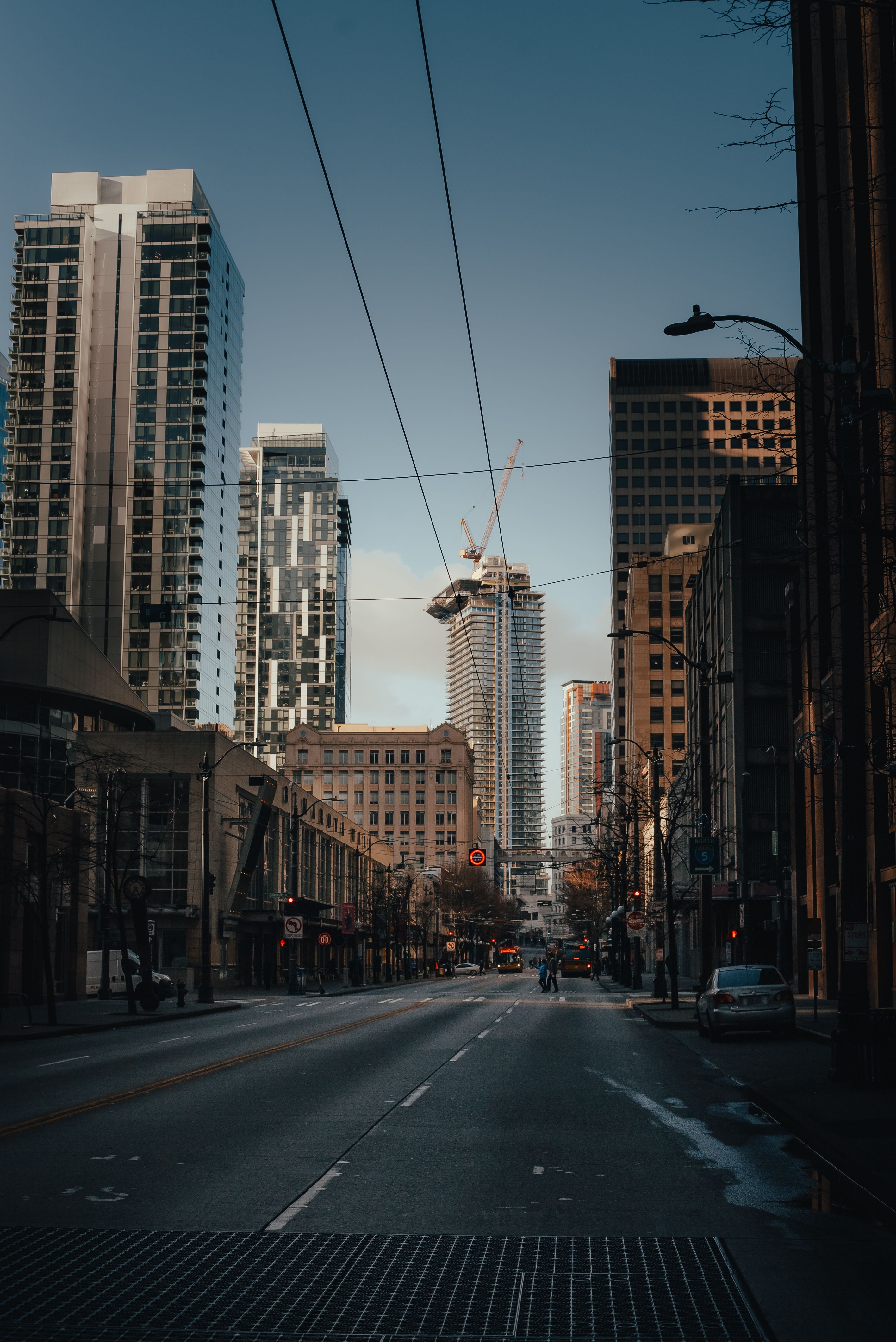 A city street with tall buildings and a street light · Free Stock Photo