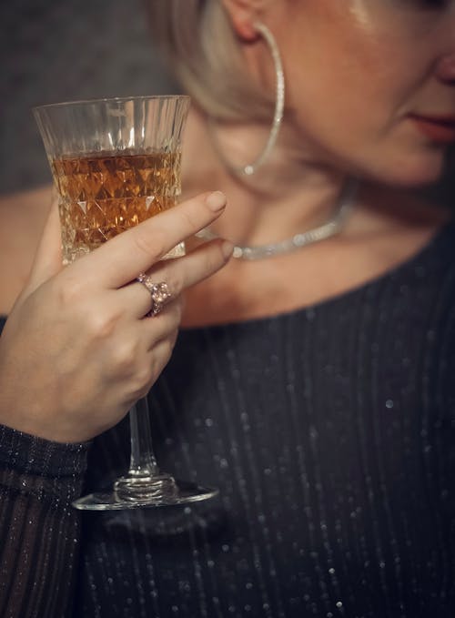 A Woman Holding a Glass of Alcohol Drink