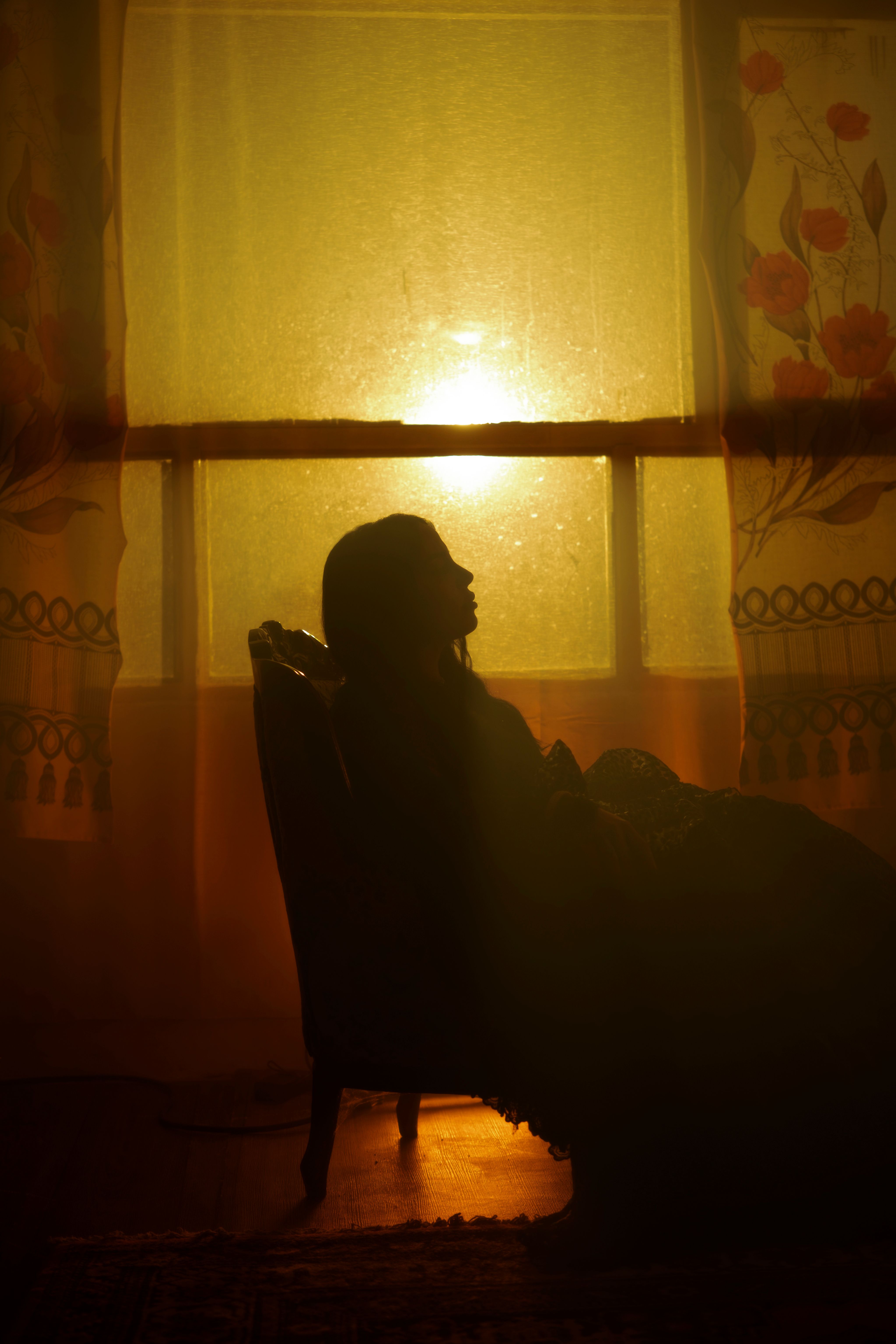 Silhouette of a Woman Sitting in an Armchair in a Dark Room · Free ...
