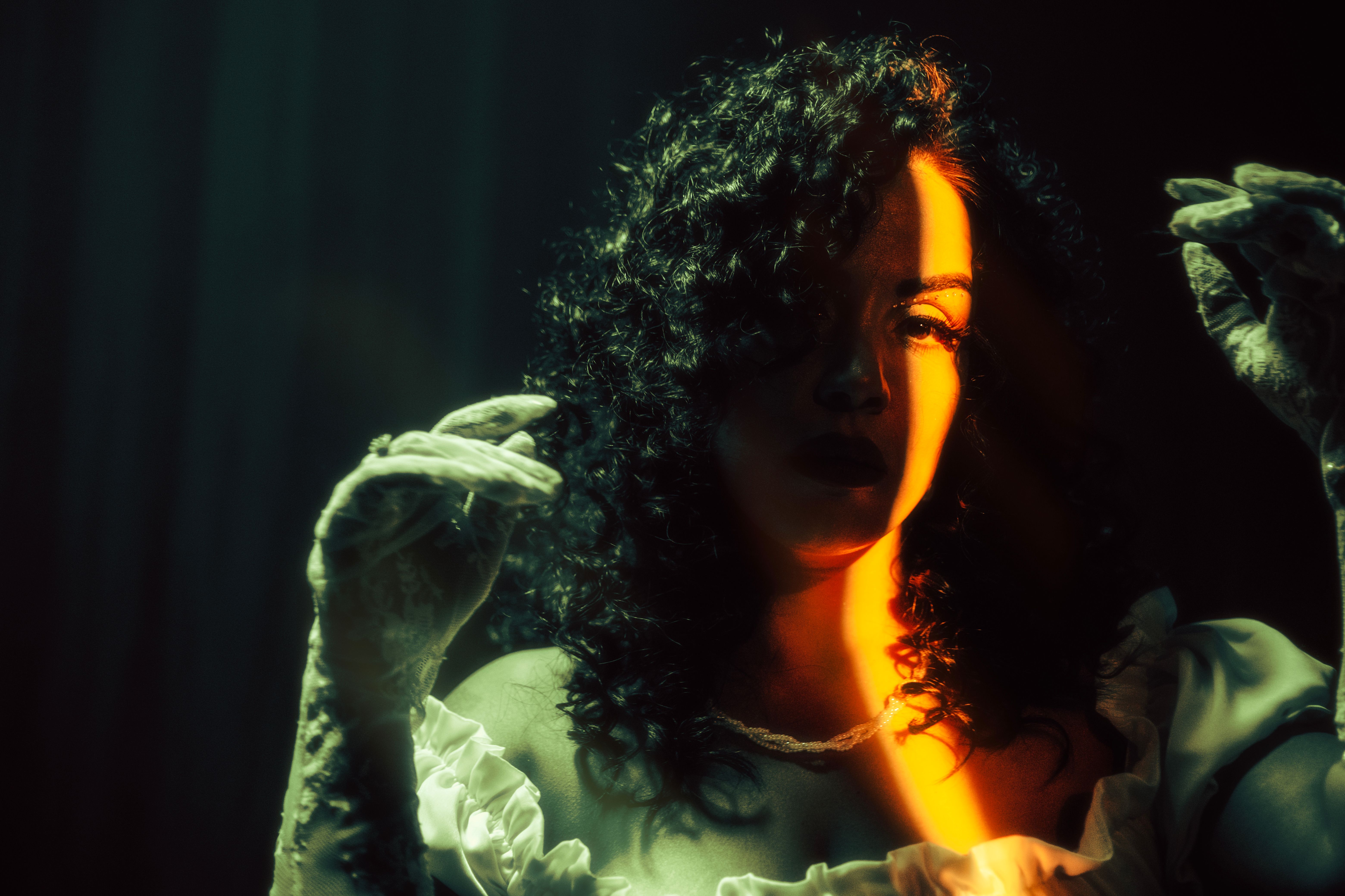 Dramatic Portrait of a Woman in Artistic Lighting · Free Stock Photo
