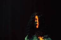 Sunbeam Shining on a Curly Brunette Woman