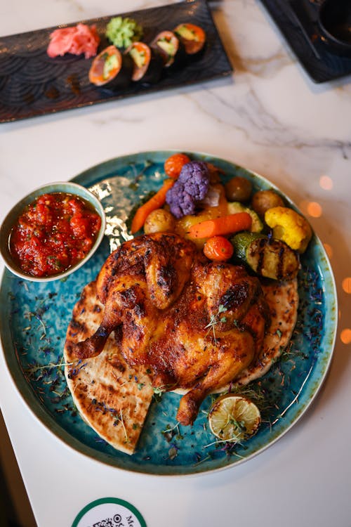 A Roast Chicken with Vegetables and Salsa