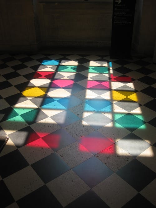 Stain glass on checkered tiles