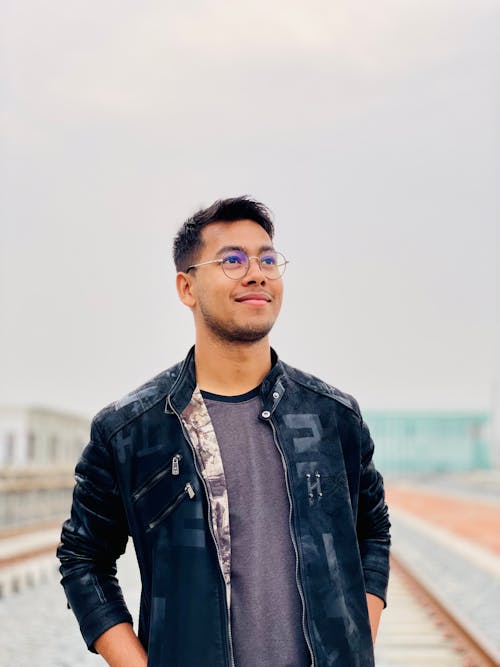 Smiling Man in Jacket and Eyeglasses