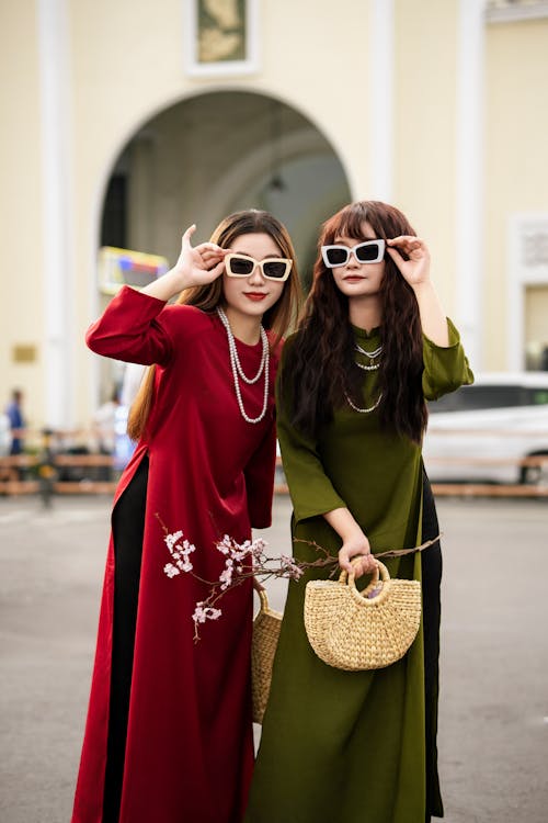 Women Wearing Long Dresses on a Street