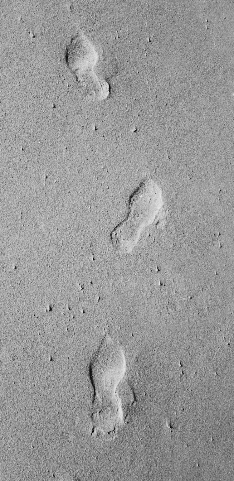 Foot Prints On Gray Surface